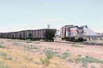 Pecos Valley Southern GE 70T #7 pulls cars from a spur.